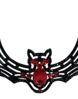 Decorative bat-shaped ornament with red gemstones